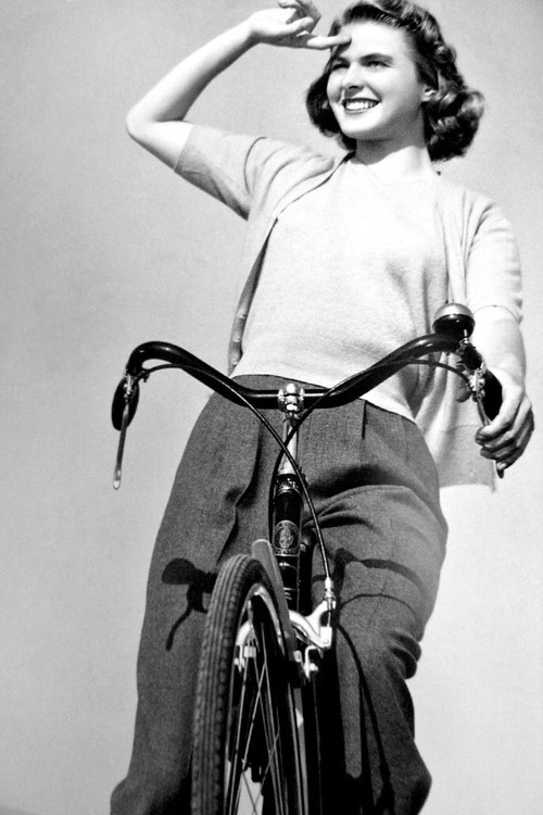 A young Ingrid Bergman on a bike