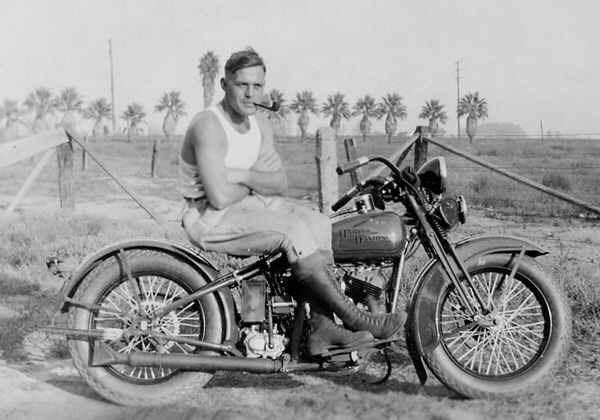 Vintage guy on a motorcycle in the desert