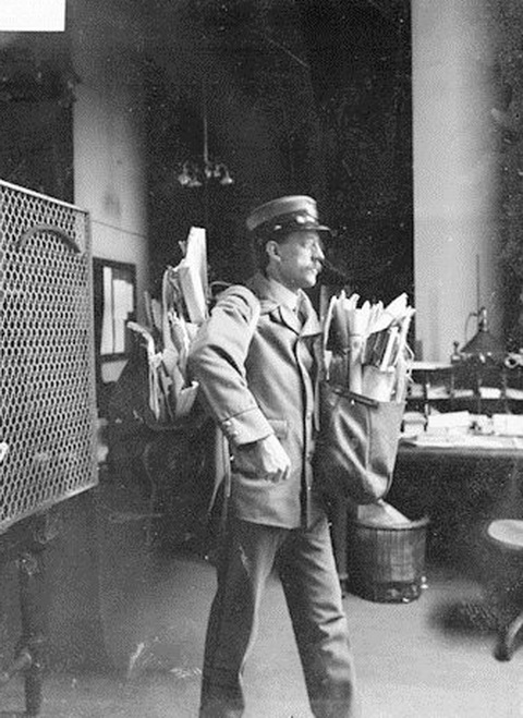 Mailman making deliveries on Valentine’s Day, Chicago (1900?)